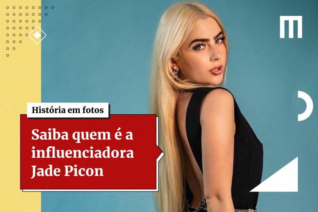 Na imagem colorida, uma mulher está posicionada à esquerda.  Ela usa roupas pretas, tem cabelos longos loiros e olha seriamente para a câmera sobre os ombros